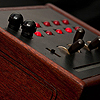 <p style='text-align: left; margin-bottom: -10px;'>The two small black knobs control level and frequency (pitch).  The toggle switches change the octave.</p><br>Photo by Seze Devres  
